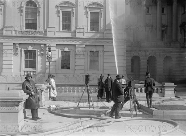 U.S. Capitol - Cleaning Exterior, 1913. Creator: Harris & Ewing.