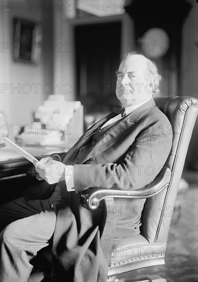 William Jennings Bryan, Rep. from Nebraska, at desk, 1914. Creator: Harris & Ewing.