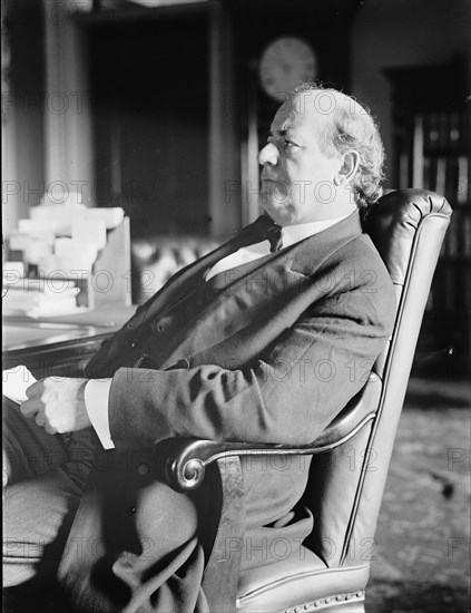 William Jennings Bryan, Rep. from Nebraska, at desk, 1914. Creator: Harris & Ewing.