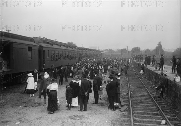 Army, U.S. Troops In Training, 1917. Crowds waving off a train packed with soldiers.