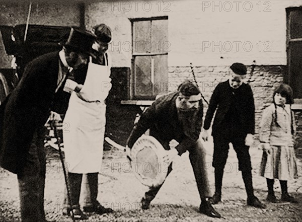 John Boyd Dunlop experiments with his pneumatic tire wheel, End of 1880s. Private Collection.