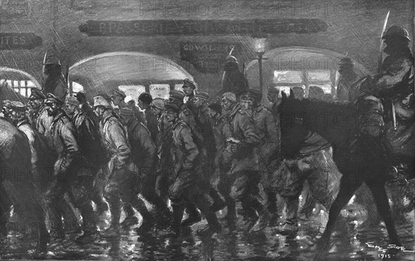 ''Arrivee a remiremont des prisonniers de l'Hartmannswillerkopf, le soir du 24 decembre 1915. Creator: Georges Bertin Scott.