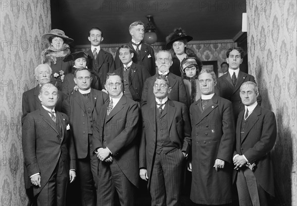 Unidentified Group On Entrance Stairway of John Barrett's Residence; 12 Men, 3 Women, Child, 1915.  Creator: Harris & Ewing.