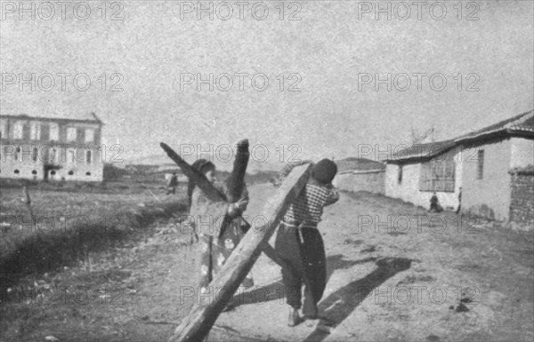 ''Impressions Macedoniennes; enfants de Guevgueli sauvant des madriers de l'incendie.', 1915. Creator: Unknown.