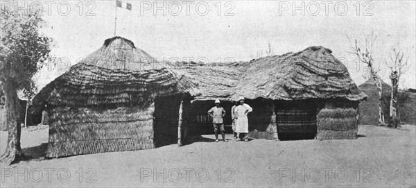 'La grande guerre en Afrique; le drapeau francais flotte sur la case du lieutenant..., c1916. Creator: Unknown.