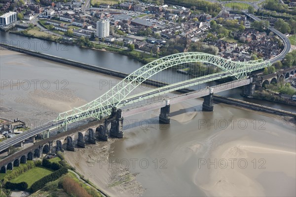 Road and rail bridges over the River Mersey and Manchester Ship Canal at Runcorn Gap, Halton, 2021.