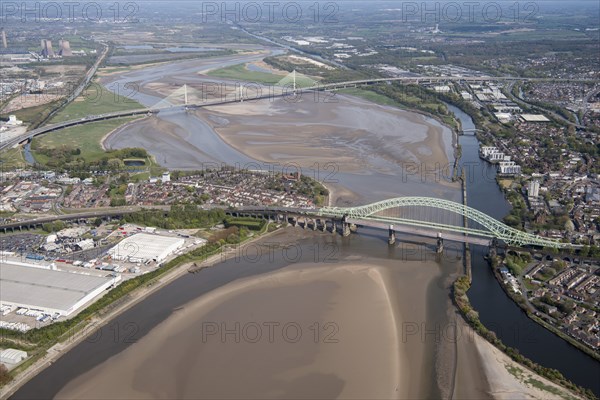 Road and rail bridges over the River Mersey and Manchester Ship Canal at Runcorn Gap, Halton, 2021.