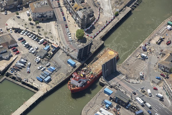 The offshore supply vessel Putford Aries passing through Lowestoft bascule bridge, Suffolk, 2021.