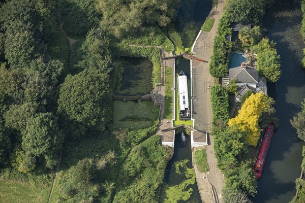 A widebeam canal boat ascending the Hanwell Lock Flight on the Grand Union Canal, Greater London Authority, 2021.