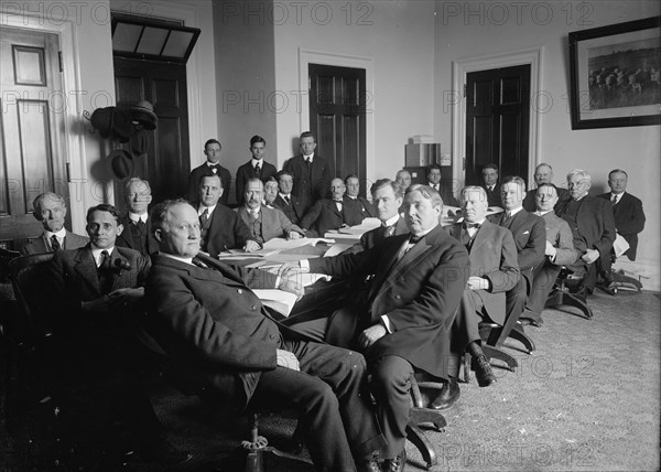 House of Representatives Committees - Agriculture. in Front of Table: Reps. Lever..., 1914 or 1916. Creator: Harris & Ewing.