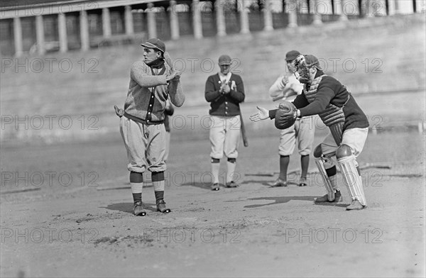 Jack Calvo at Bat, Vic Bickers (Maybe) in Dark Sweater Holding Bat, Al Scheer Left of..., ca. 1913. Creator: Harris & Ewing.