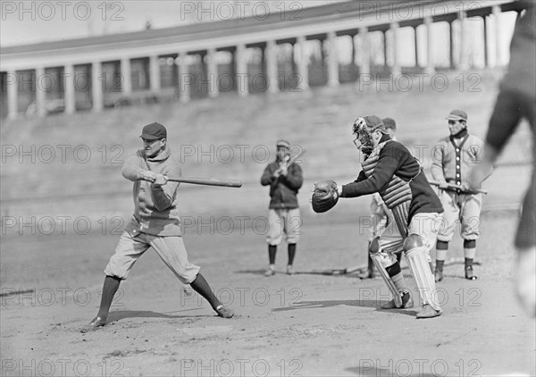 Joe Connolly at Bat, Jack Calvo at Right, Washington Al, at University of Virginia..., ca. 1913. Creator: Harris & Ewing.