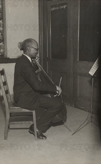 A cello student of the Adult Education Classes under the Federal Music Project at Carlton YMCA, 1936.