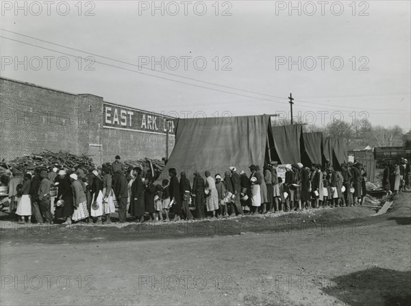 African Americans holding their pots and pans, and waiting for their turn to get meals, Feb. 1937.