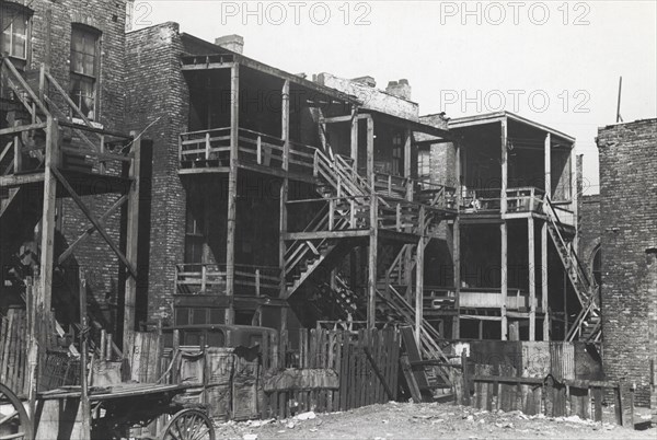 Back steps of apartments in Negro section of Chicago, Illinois, April 1941.