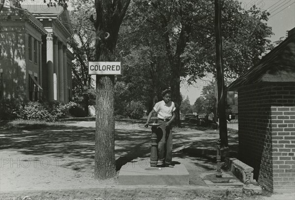 Drinking fountain on the county courthouse lawn, Halifax, North Carolina, 1938-04. Creators: Farm Security Administration, John Vachon.