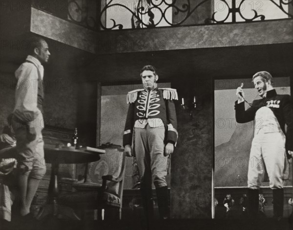 Three men, one with monocle, 1938.