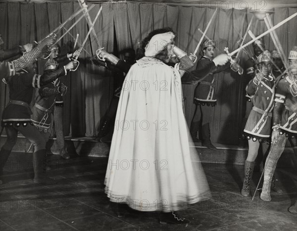 Soldiers with swords raised, 1936.