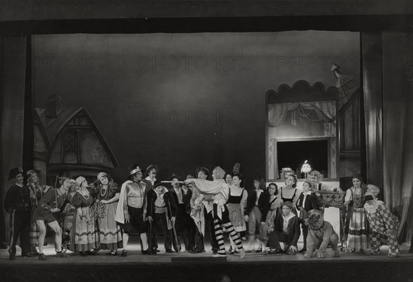 Pinocchio cast with man pointing sticks, 1938-1939.