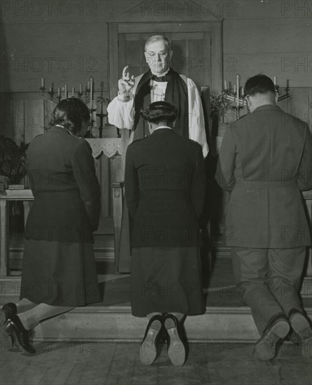 An Episcopal Bishop confirming African American Lieutenants Rosemary Vincent..., 1939 - 1945. Creator: United States Army.