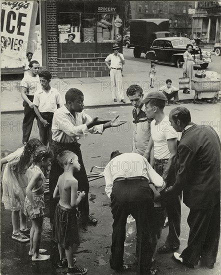 Eastside - Group of men and youths gathered around an accident victim; one young..., 1947 - 1951. Creator: Romulo Lachatanere.