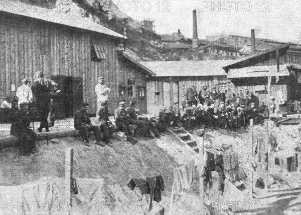 'Marseille en Fete; Prisonniers allemands au repos devant leurs baraquements a l'Estaque', 1916. Creator: Unknown.