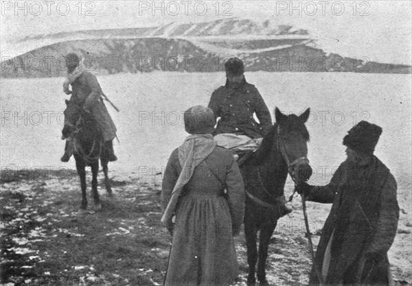 'L'interrogatoire d'un officier turc prisonnier qui, ayant les pieds geles, a ete hisse..., 1916. Creator: Unknown.