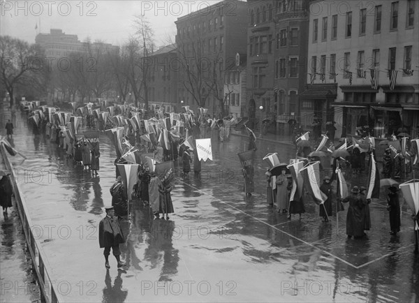 Woman Suffrage - Marching in Rain, 1917. Creator: Harris & Ewing.