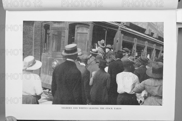 Negroes and Whites leaving the stock yards, 1922. Creator: Unknown.