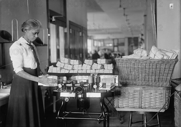 Post Office Department - Opening Machine, 1917. Creator: Harris & Ewing.