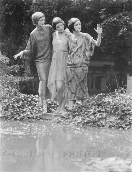 People wearing masks made by W.T. Benda, 1925 Sept. 20. Creator: Arnold Genthe.