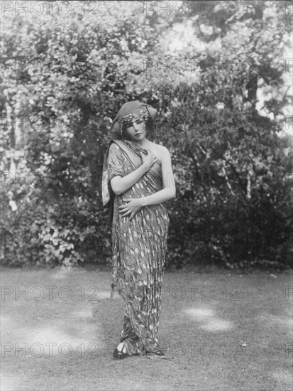 Person wearing a mask made by W.T. Benda, 1925 Sept. 20. Creator: Arnold Genthe.