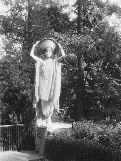 Person wearing a mask made by W.T. Benda, 1925 Sept. 20. Creator: Arnold Genthe.