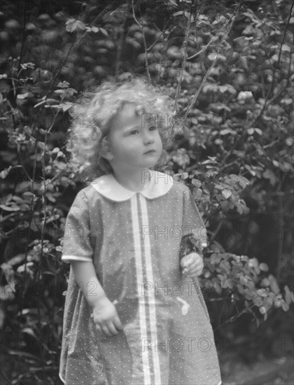 McCormick, Medill, child of, standing outdoors, 1923 May 21. Creator: Arnold Genthe.