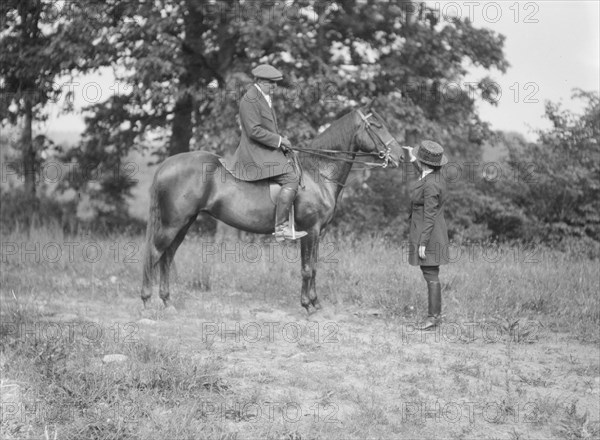 Bruce, J.M., Mr., on horseback, with Mrs. Bruce, 1919 May 30. Creator: Arnold Genthe.