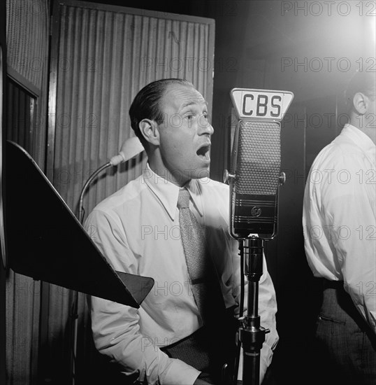 Portrait of Buddy Clark, CBS studio, New York, N.Y., 1946. Creator: William Paul Gottlieb.