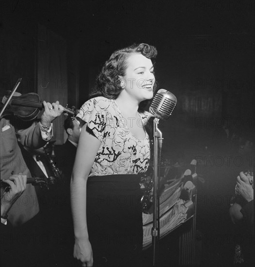 Portrait of a vocalist with Justin Stone's ensemble, 1938. Creator: William Paul Gottlieb.