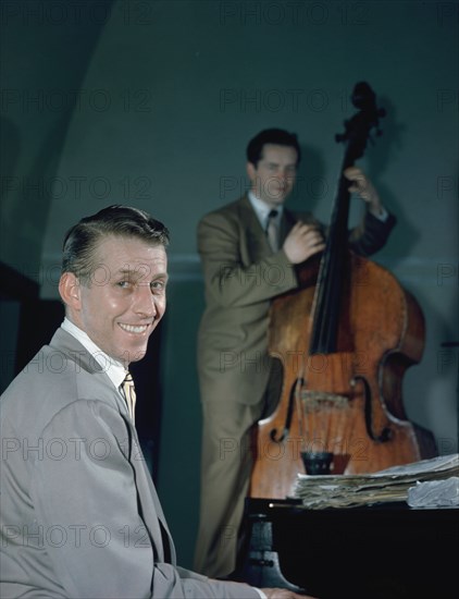 Portrait of Stan Kenton and Eddie Safranski, 1947 or 1948. Creator: William Paul Gottlieb.