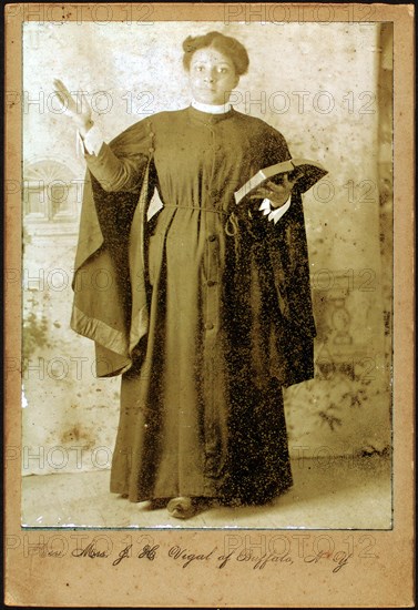 Rev. Mrs. J. H. Vigal of Buffalo, N.Y., arm raised, holding Bible, c1880-c1889. Creator: Unknown.