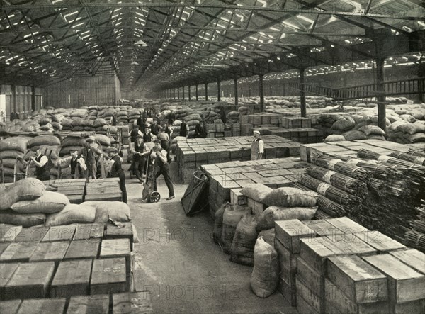 Traffic and Merchandise Multiplied Century By Century A Dock Transit Shed', 1937. Creator: Unknown.