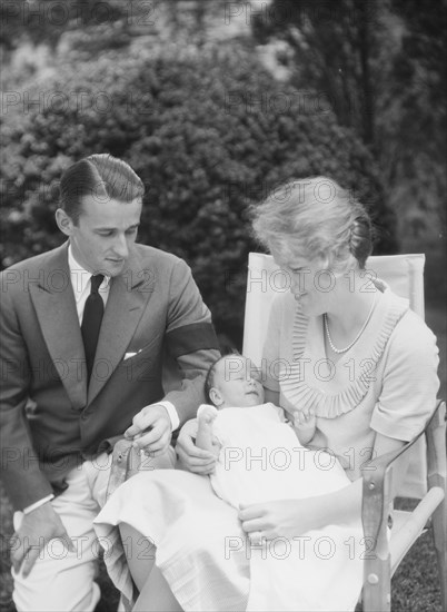 Brady, James Cox, Jr., Mr. and Mrs., and child, seated outdoors, 1930 May 24. Creator: Arnold Genthe.