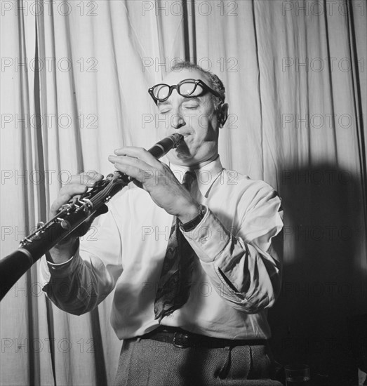 Portrait of Mezz Mezzrow in his office, New York, N.Y., ca. Nov. 1946. Creator: William Paul Gottlieb.