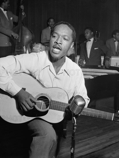 Portrait of Josh White, Café Society (Downtown), New York, N.Y., ca. June 1946. Creator: William Paul Gottlieb.