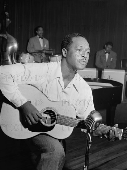 Portrait of Josh White, Café Society (Downtown), New York, N.Y., ca. June 1946. Creator: William Paul Gottlieb.