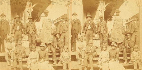 Simplicity, Alabama, U.S.A. [Group gathered on a porch, in town], (1868-1900?). Creator: Benjamin West Kilburn.