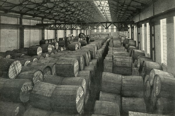 In the Warehouses of the P.L.A. with their Accommodation for a Million Tons -Tobacco...', 1937. Creator: Unknown.