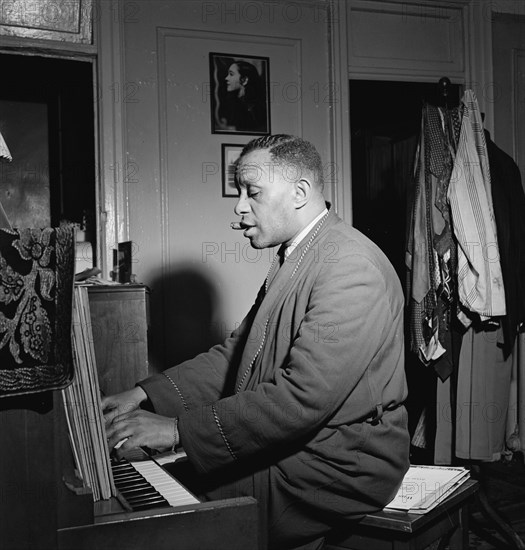 Portrait of Willie Smith in his apartment, Manhattan, New York, N.Y., ca. Jan. 1947. Creator: William Paul Gottlieb.