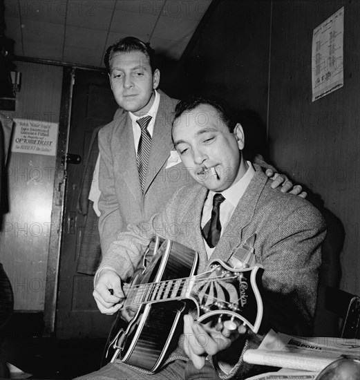 Portrait of Django Reinhardt and David Rose, Aquarium, New York, N.Y., ca. Nov. 1946. Creator: William Paul Gottlieb.