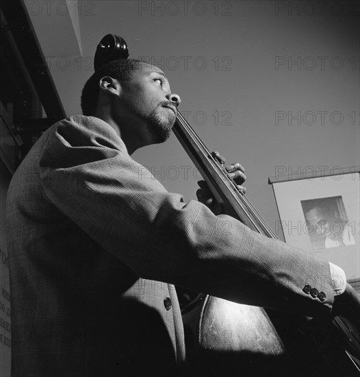 Portrait of John Simmons, William P. Gottlieb's office, New York, N.Y., ca. July 1947. Creator: William Paul Gottlieb.