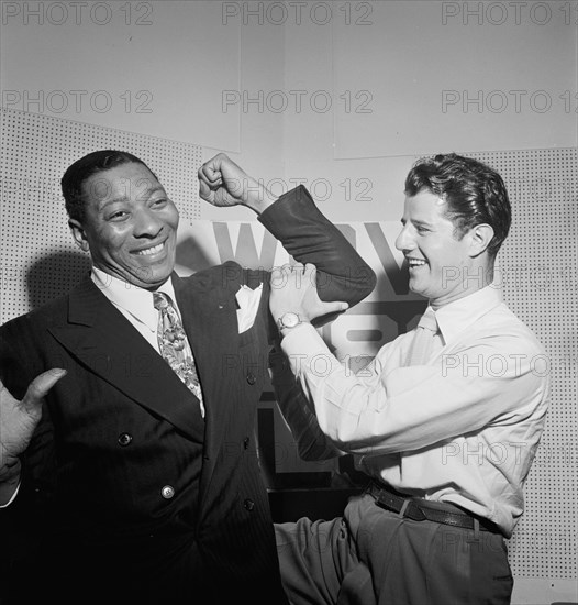 Portrait of Sid Catlett and Freddie Robbins, WOV office, New York, N.Y., ca. June 1947. Creator: William Paul Gottlieb.